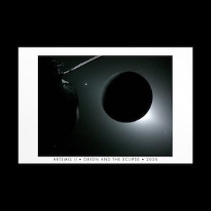 May include: A black and white print featuring a dark silhouette of the Orion spacecraft against a bright solar eclipse, with the text ARTEMIS II • ORION AND THE ECLIPSE • 2026 printed in black at the bottom of the white border surrounding the image.