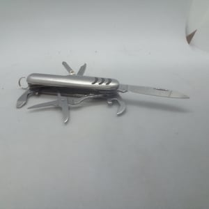 May include: A set of three ceramic mugs with a speckled, matte finish. Each mug features a different color: light blue, cream, and gray. The mugs have a simple, modern design and a comfortable handle.