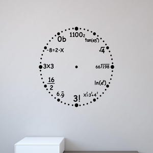 May include: A black wall clock decal featuring mathematical equations and expressions in place of standard numbers. The circular design includes dots for minute markers and various math problems like 3!, 16/2, and tan(45) arranged around the center.
