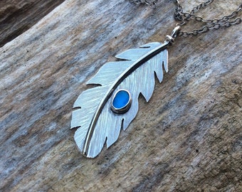 Sea glass jewelry,  Sea glass necklace,  Bezel set blue sea glass and sterling silver hand cut feather necklace