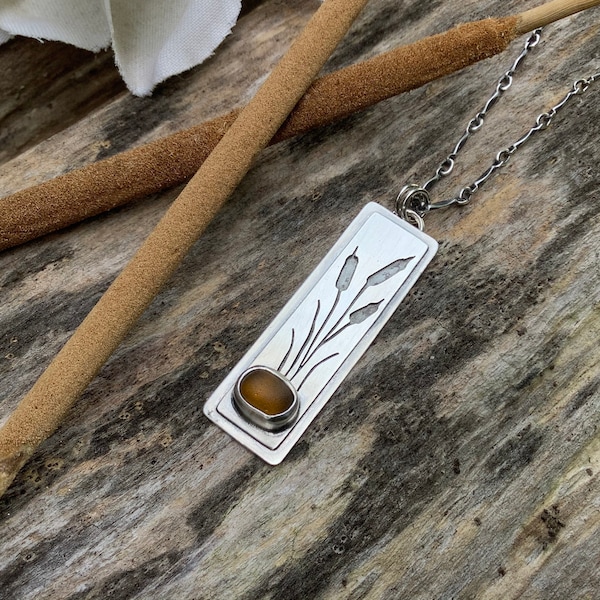 Sea glass jewelry,  Sea glass necklace,  Bezel set brown sea glass and hand sawn sterling silver cattail necklace