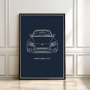 Może przedstawiać: Oprawiony wydruk z białym rysunkiem liniowym samochodu sportowego Honda S2000 AP1 na ciemnoniebieskim tle. Samochód jest przedstawiony z przodu, z widocznymi reflektorami, grillem i przednią szybą. Tekst "HONDA S2000 AP1" jest wydrukowany poniżej.