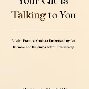 May include: A book cover with the title "Your Cat Is Talking to You" in black and brown text. The subtitle reads "A Calm, Practical Guide to Understanding Cat Behavior and Building a Better Relationship." The author is The D.E.V.