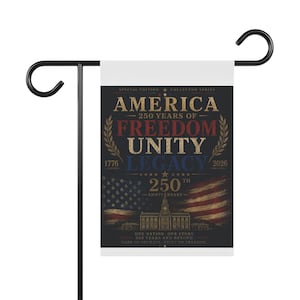 May include: A garden flag with a black metal stand. The flag displays patriotic text and imagery, including the words "America," "Freedom," "Unity," and "Legacy." It also features the years 1776 and 2026, and a depiction of the American flag.