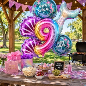 May include: A balloon bouquet featuring a large iridescent number 9, two round Happy Birthday balloons with sea life graphics, two purple shell-shaped balloons, and a mermaid tail balloon, displayed above a table with party snacks and decor.