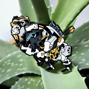 May include: A metal enamel pin featuring a stylized robotic creature with a black, white, and yellow color scheme. The design includes intricate mechanical details, sharp geometric shapes, and bright blue accents on the head and back components.