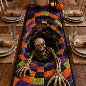 May include: A rectangular quilted table runner featuring a 3D-effect vortex pattern in black, purple, orange, and lime green. A realistic human skeleton figure with glowing red eyes emerges from the center, reaching out with both bony hands.