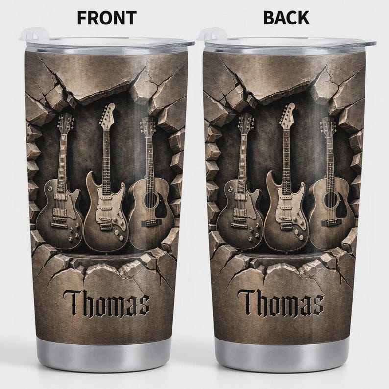 May include: Stainless steel tumbler featuring a design of four guitars emerging from a cracked stone background. The name "Thomas" is displayed in a decorative font below the guitars. The front and back of the tumbler are shown.
