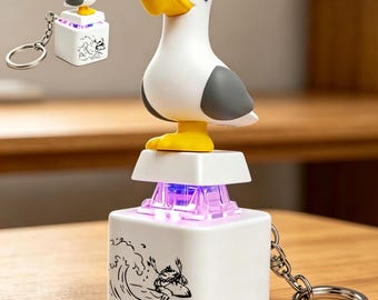 Llavero con forma de gaviota, juguete mecánico con botón para encender, encender y hacer ruido, juguete sensorial portátil para aliviar el estrés, divertido para el escritorio.