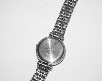 base metal bezel stainless steel back