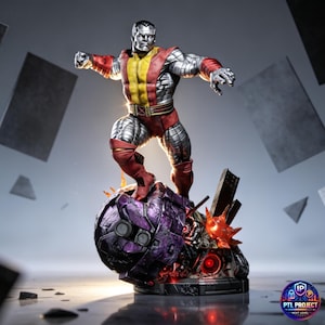 May include: A Colossus statue in a dynamic pose, standing atop a purple and black robotic base. The figure is clad in red, yellow, and silver armor. The base features a cityscape and fiery details. The statue is a collectible item.