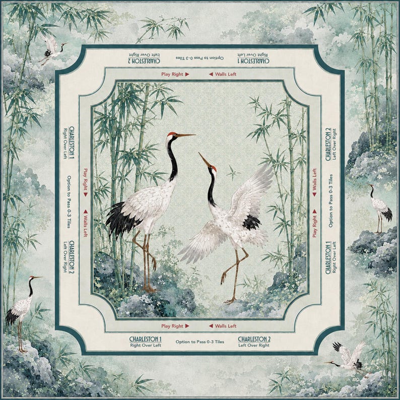 May include: A square mahjong mat featuring a central illustration of two red-crowned cranes among bamboo stalks. The border includes instructional text for Charleston 1 and 2, with arrows indicating play directions and wall movements in a soft green palette.