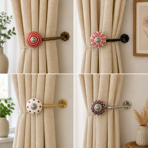 May include: A collection of four curtain tiebacks featuring round decorative knobs in various patterns including red stripes, red leaf motifs, red polka dots, and a red floral design, each mounted on a metal arm attached to a wall plate.