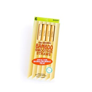 May include: A package of six short bamboo smoothie straws by The Aloha Straw Company. The packaging is yellow and white with the text The Original Bamboo Smoothie Straws, Ideal for Boba/Bubble Tea, and Aloha printed on each individual straw.