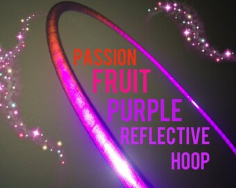 May include: A purple reflective hoop with the words "Passion Fruit Purple Reflective Hoop" in the image. The hoop is illuminated with a bright purple light and has a sparkling effect.