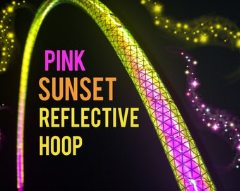May include: A neon green and pink reflective hoop with the text "PINK SUNSET REFLECTIVE HOOP" in pink, orange, and yellow. The hoop has a geometric pattern and is set against a black background with sparkling star accents.