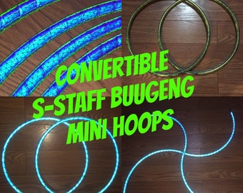 May include: Two blue and green LED hoop sets, one set is in a circle shape and the other is in a curved shape. The hoops are on a wooden floor. The text "CONVERTIBLE S-STAFF BUUGENG MINI HOOPS DANCEHOOPS.ETSY.COM" is on the image.