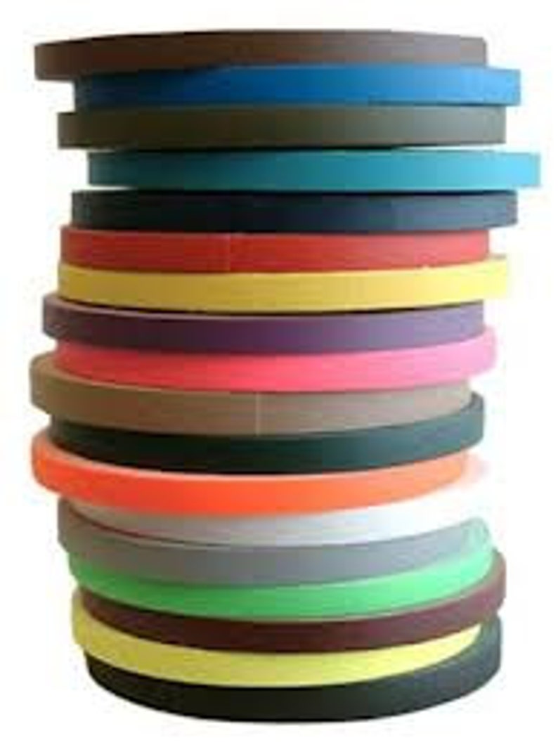 May include: A stack of 20 rolls of colourful duct tape. The tape is 2.5 cm wide and comes in a variety of colours, including red, blue, green, yellow, orange, purple, brown, black, and white.