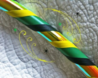 May include: A colorful hoop with yellow, green, and black tape wrapped around a rainbow iridescent base.