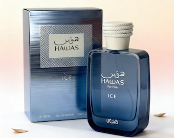May include: A blue perfume bottle and box set. The bottle is a gradient of blue and features the text "HAWAS For Him ICE". The box is a matching blue with the text "HAWAS ICE". The set contains 3.38 fl oz (100 ml) of perfume.