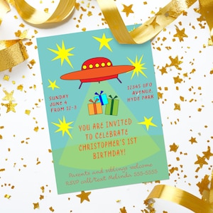 May include: A birthday party invitation with a cartoon UFO design. The invitation is teal with a red and orange UFO, yellow stars, and the text "You are invited to celebrate Christopher's 1st birthday!" Gold ribbon and star confetti surround the invitation.