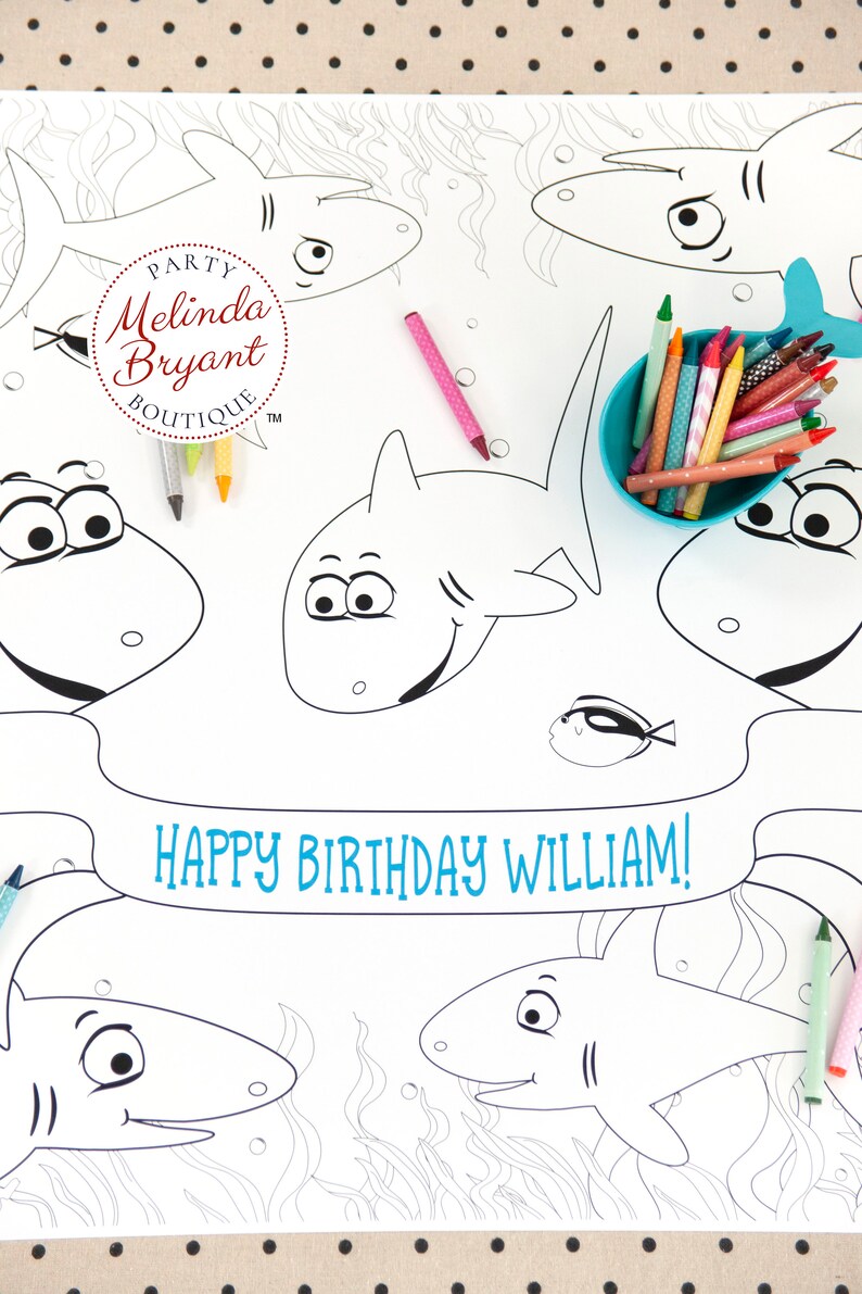 May include: A black and white coloring page featuring sharks and a banner that says "Happy Birthday William!" The page is surrounded by a dotted pattern.
