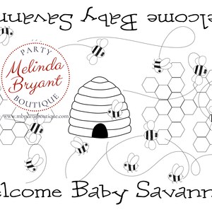 A table is set for a bee themed party or baby shower. A table length coloring page is laid over a dotted tablecloth. The design features happy bees, honeycombs, and a hive in the center. Optional text runs lengthwise along the edges. There are brightly painted honey jars filled with crayons on the table. This listing is for the coloring table runner only.