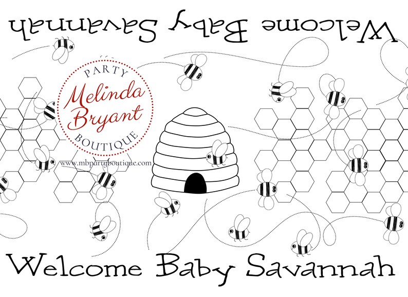 A table is set for a bee themed party or baby shower. A table length coloring page is laid over a dotted tablecloth. The design features happy bees, honeycombs, and a hive in the center. Optional text runs lengthwise along the edges. There are brightly painted honey jars filled with crayons on the table. This listing is for the coloring table runner only.