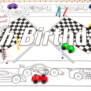 May include: A white coloring placemat with a race car theme, featuring the text "4th Birthday" in large letters. The placemat is decorated with race cars, checkered flags, and toy cars in various colors, along with crayons.