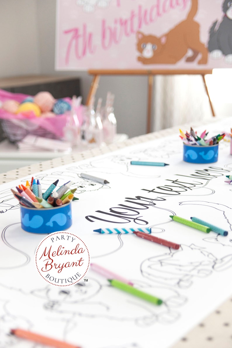A white paper coloring table cloth with the words "Your text here" printed in black. There are crayons scattered around the table runner. There are two blue containers filled with crayons.