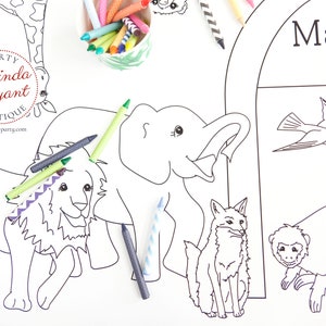 May include: A large white coloring sheet featuring outlines of zoo animals, including a lion, elephant, tiger, and monkey. Crayons in various colors are scattered around the sheet. The words "Madison Zoo" are printed at the top.