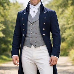 May include: A navy blue coat with gold buttons, a gray vest, white trousers, and black boots. The outfit includes a white cravat. The ensemble is reminiscent of historical military or formal attire.