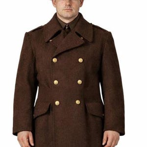 May include: A brown wool coat with gold buttons, a matching hat, and trousers. The double-breasted coat has a classic design with a notched collar and two rows of four buttons. The hat has a flat brim. The trousers and boots complete the uniform.