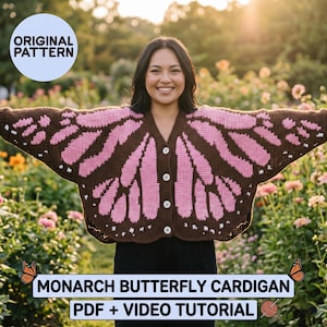 May include: A brown and pink Monarch butterfly cardigan with white buttons. The cardigan features a butterfly wing design. The image also includes the text "Original Pattern" and "Monarch Butterfly Cardigan PDF + Video Tutorial".
