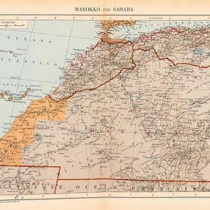 Op de afbeelding: Een antieke gedrukte kaart getiteld MAROKKO UND SAHARA met geografische kenmerken, grenzen en steden in Noord-Afrika. De kaart bevat de Canarische Eilanden, de Middellandse Zee en regio's met een schaal van 1:10 000 000.