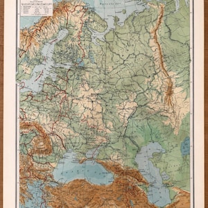 May include: A vintage paper map titled OOST-EUROPA, depicting Eastern Europe with detailed topography in shades of green, brown, and blue. The map features geographical labels, a scale, and a legend in the upper left corner, with a border frame.