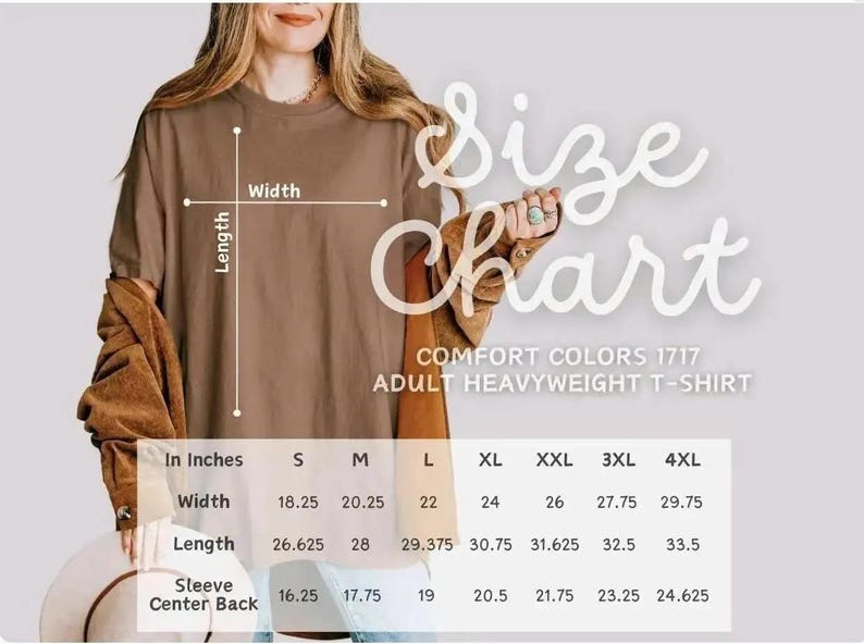 Op de afbeelding: Een bruin Comfort Colors 1717 zwaar t-shirt voor volwassenen met een maattabel. De tabel toont de afmetingen in cm voor breedte, lengte en mouwrug voor de maten S t/m 4XL.