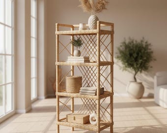 May include: A tall, four-tiered rectangular shelving unit crafted from light-coloured woven rattan. The frame features a distinct crisscross lattice pattern on the sides and back, providing an open structure for displaying various decorative items.