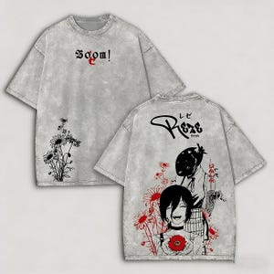 May include: Gray t-shirt with front and back graphics. The front features the word "Boom!" and a floral design. The back displays an anime-style illustration with the word "Reze" and more floral elements. The shirt has a vintage, washed look.