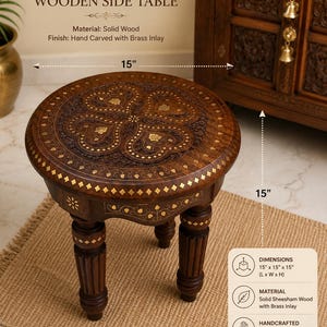 May include: A round wooden side table featuring intricate hand-carved patterns and decorative brass inlay. The table has four carved legs and measures 15 inches in length, 15 inches in width, and 15 inches in height as indicated by the text.