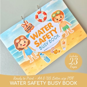 May include: A spiral-bound Water Safety Busy Book featuring a beach scene with illustrations of children, a life preserver, a life vest, a water bottle, sunscreen, and a whistle. The cover includes the text Water Safety Busy Book and Belongs to.