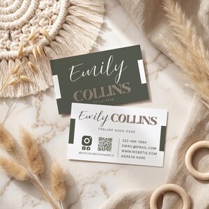 May include: Two rectangular business cards featuring the name Emily Collins. One card is dark olive green with white accents, while the other is white with dark olive green accents, displaying a QR code, social media icons, and contact details.
