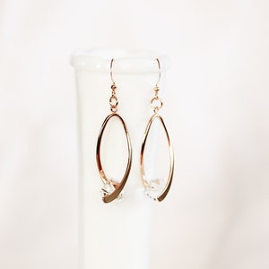Ribbon twist dangle earrings, gold plated brass, clear crystal