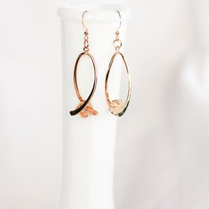 Ribbon twist dangle earrings, gold plated brass, light peach crystal
