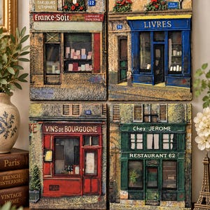May include: A set of four rectangular wall plaques depicting French storefronts. The scenes include a bookstore with France-Soir signage, a blue bookstore labeled Livres, a red wine shop marked Vins de Bourgogne, and a green restaurant named Chez Jerome.
