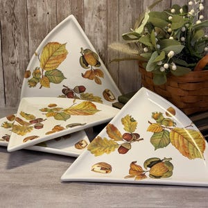 Set of four vintage Italian hand-painted triangular vegetable serving dishes.