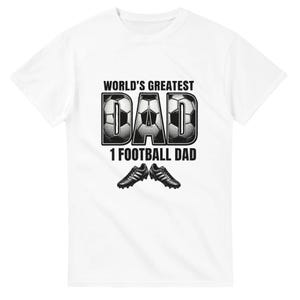 May include: A white short-sleeve t-shirt featuring a graphic print with the text WORLD'S GREATEST DAD and 1 FOOTBALL DAD. The letters DAD are filled with a black and white soccer ball pattern, and two black soccer cleats are positioned below the text.