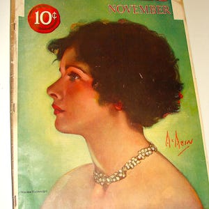 May include: A vintage cover of McCall's magazine from November, featuring a portrait of Norma Talmadge, a famous actress of the silent film era. The cover is green and features a large, bold title "McCall's" and the price "10¢". The text "Ethel Barrymore's First Short Story" is also visible.