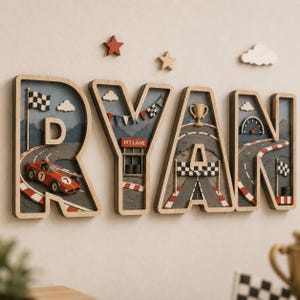 May include: A wooden wall sign spelling the name RYAN, where each letter features a 3D racing theme. The design includes a red race car, a pit lane, a trophy, a checkered flag, and a speedometer, accented by small wooden stars and clouds above.