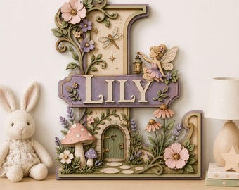 May include: A decorative wooden letter L wall plaque featuring the name LILY in raised lettering. The design includes a fairy holding a lantern, a dragonfly, pink and purple flowers, green vines, and a small arched door with mushrooms.